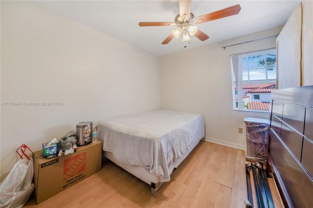 20935 SW 84th Ave Unit 20935, Cutler Bay, FL 33189 - bedroom featuring light wood-type flooring, baseboards, and a ceiling fan
