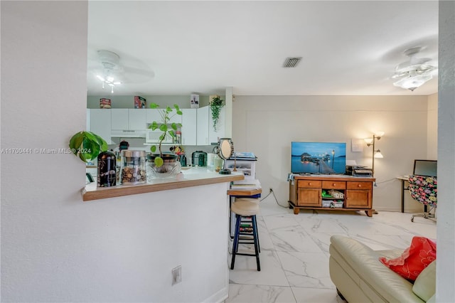 20935 SW 84th Ave Unit 20935, Cutler Bay, FL 33189 - living room featuring light marble finish floors and a ceiling fan