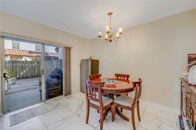 dining room featuring a chandelier