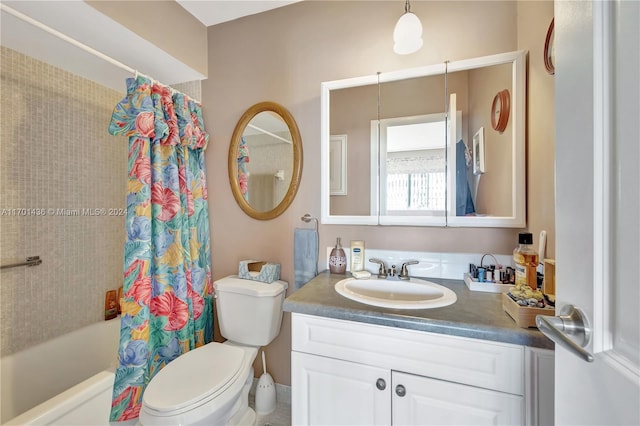 full bathroom featuring vanity, shower / bathtub combination with curtain, and toilet