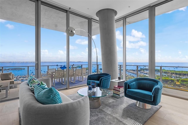 2675 S Bayshore Dr Unit 1602S, Miami, FL 33133 - sunroom / solarium featuring a water view, a wall of windows, and wood finished floors