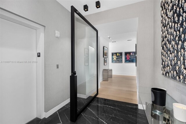 2675 S Bayshore Dr Unit 1602S, Miami, FL 33133 - bathroom with marble tiled floors and baseboards