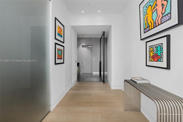 corridor featuring light hardwood / wood-style flooring