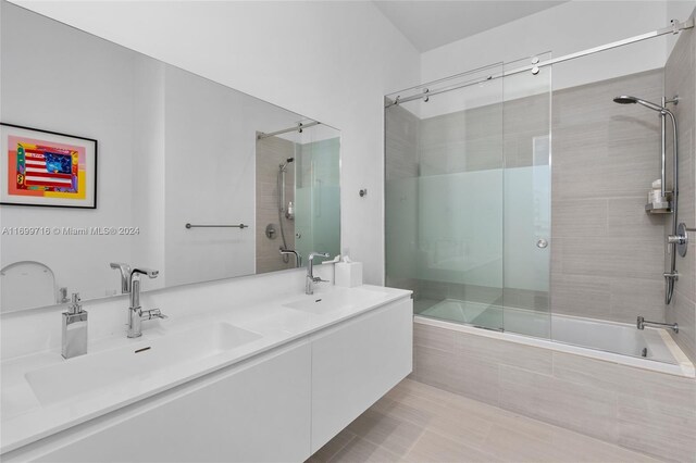 2675 S Bayshore Dr Unit 1602S, Miami, FL 33133 - bathroom with tiled shower / bath and double vanity