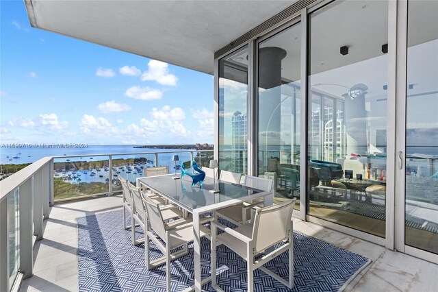 2675 S Bayshore Dr Unit 1602S, Miami, FL 33133 - balcony featuring a water view and outdoor dining space