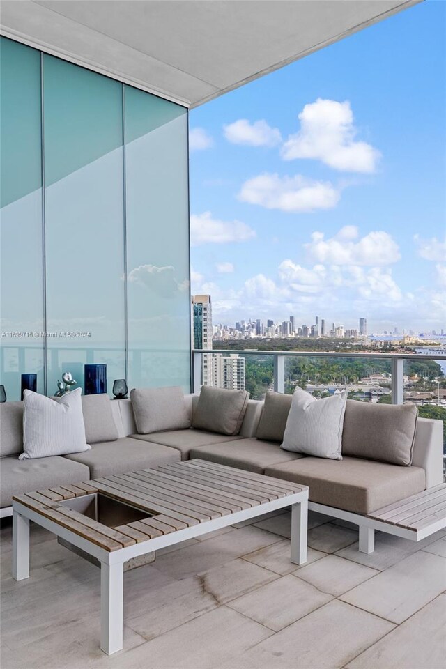 2675 S Bayshore Dr Unit 1602S, Miami, FL 33133 - balcony with an outdoor hangout area and a skyline view
