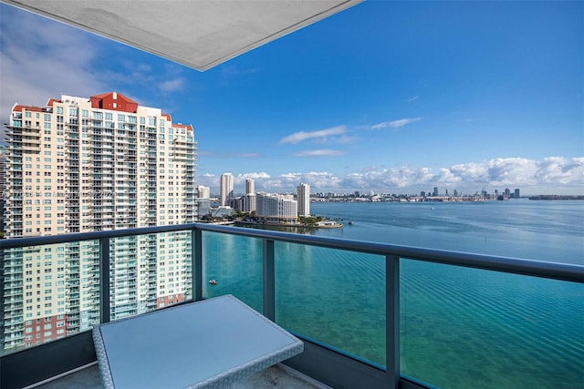 balcony featuring a water view