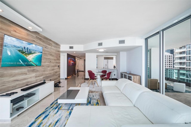 living room featuring wooden walls