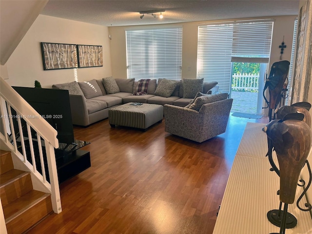 10244 NW 51st Ter, Doral, FL 33178 - living room with a textured ceiling, stairs, and wood finished floors