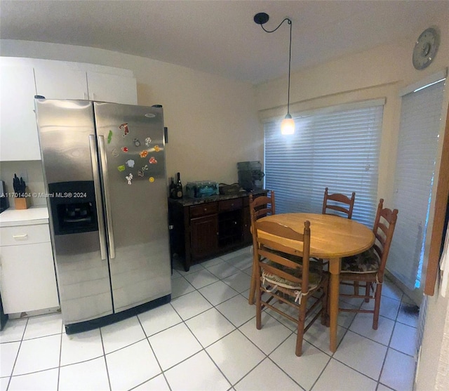 dining space with light tile patterned floors