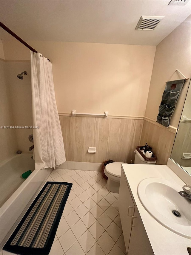 10244 NW 51st Ter, Doral, FL 33178 - full bathroom with visible vents, tile patterned floors, vanity, shower / tub combo, and wainscoting