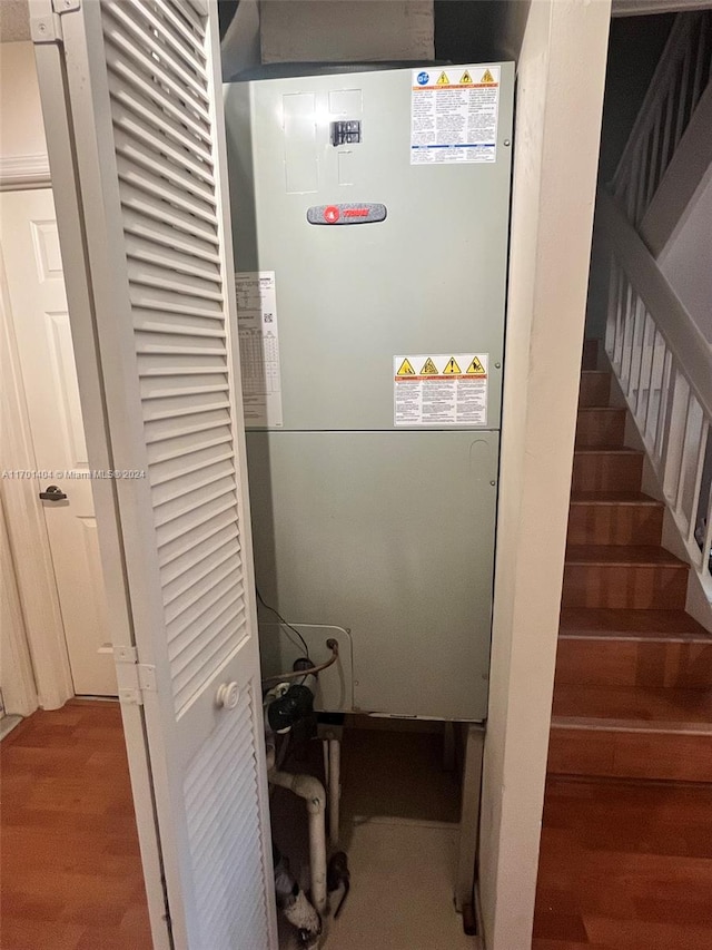 utility room featuring heating unit