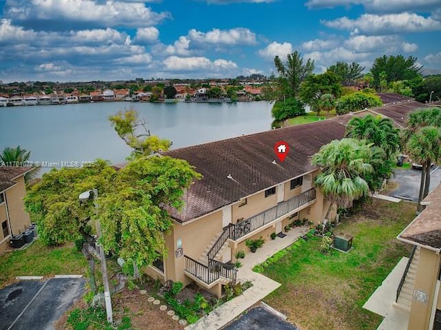 birds eye view of property featuring a water view