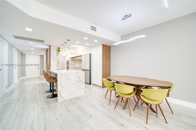 dining area featuring light hardwood / wood-style floors