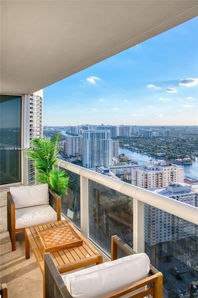 balcony featuring a water view