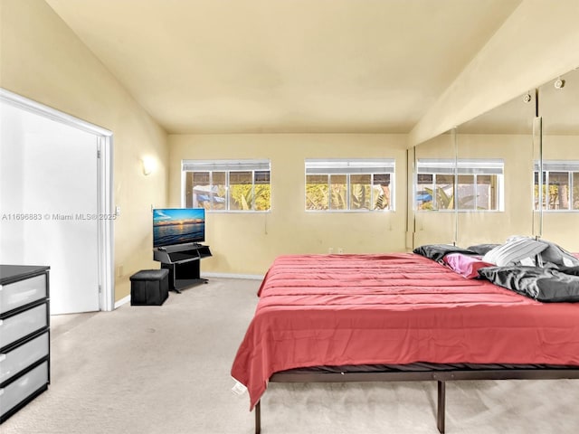 bedroom featuring baseboards and carpet flooring