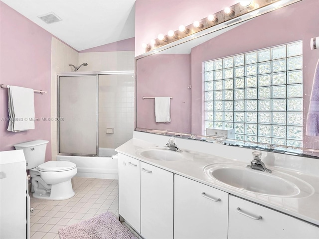 full bath featuring double vanity, lofted ceiling, a sink, and tile patterned floors