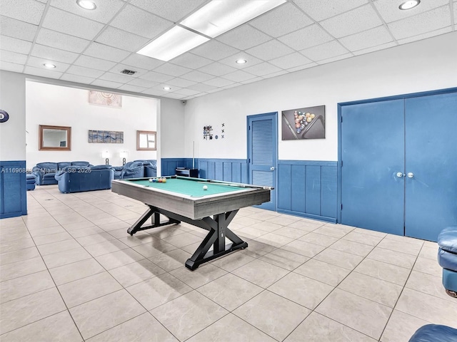 recreation room featuring pool table, wainscoting, a paneled ceiling, and tile patterned floors