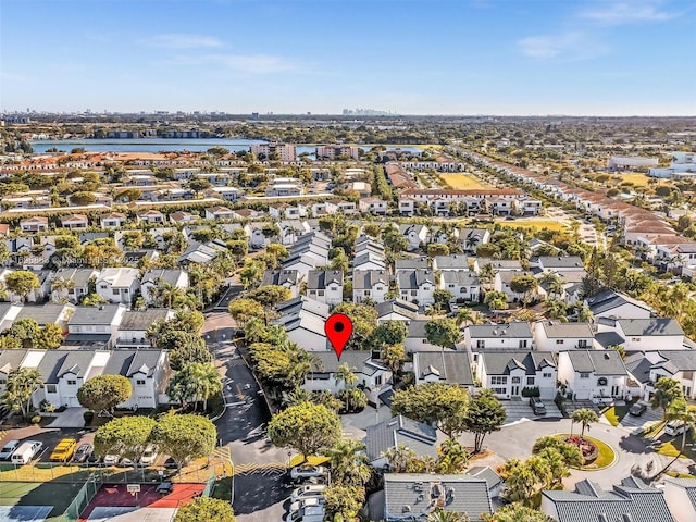 birds eye view of property featuring a water view and a residential view