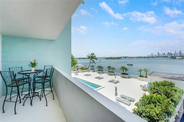 balcony featuring a water view