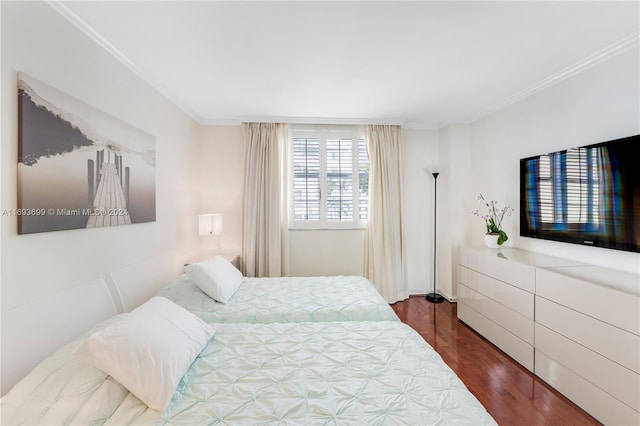 bedroom featuring dark hardwood / wood-style floors and ornamental molding