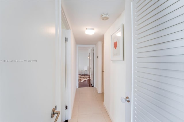 hallway featuring light tile patterned flooring