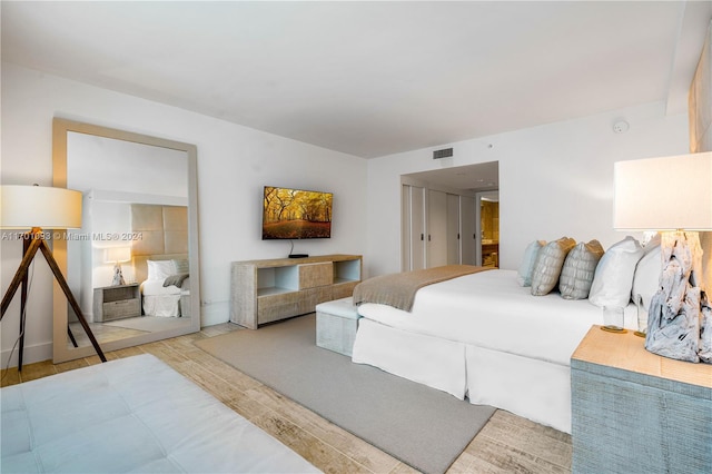 bedroom with light hardwood / wood-style floors