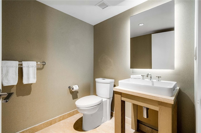 bathroom with tile patterned flooring and toilet