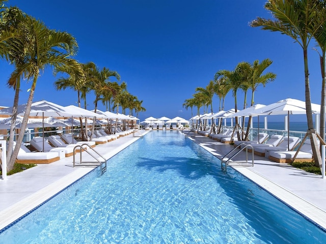 view of swimming pool with a water view