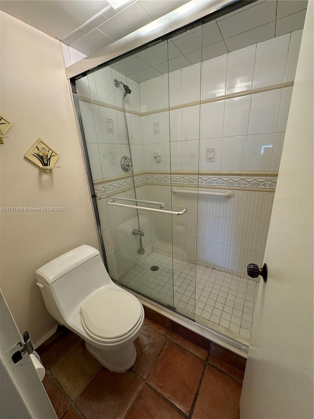 bathroom with toilet and walk in shower