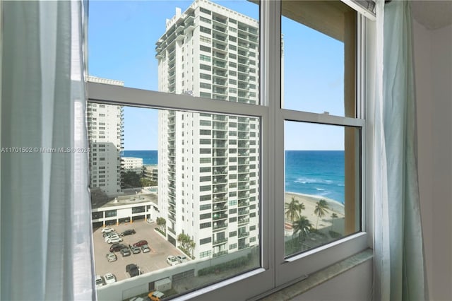 balcony with a view of the beach and a water view