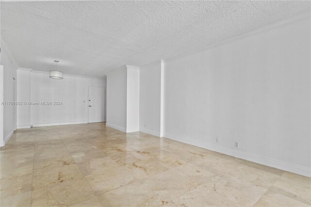 empty room featuring a textured ceiling