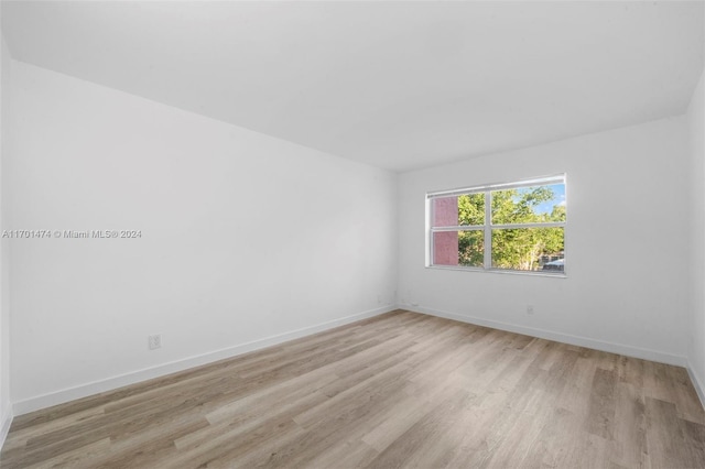 unfurnished room featuring light hardwood / wood-style floors