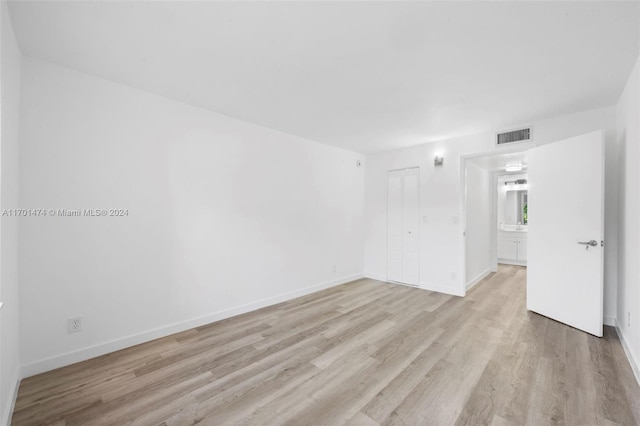 empty room with light wood-type flooring