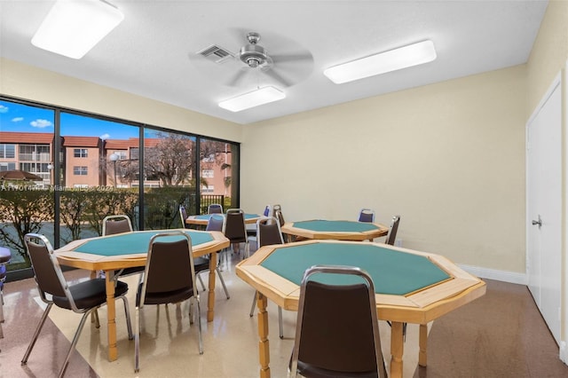 playroom with light carpet and ceiling fan