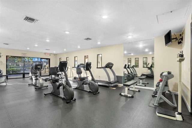 gym with a textured ceiling