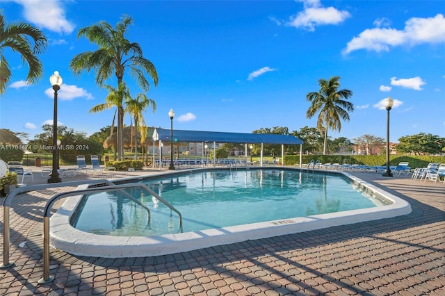 view of swimming pool featuring a patio area