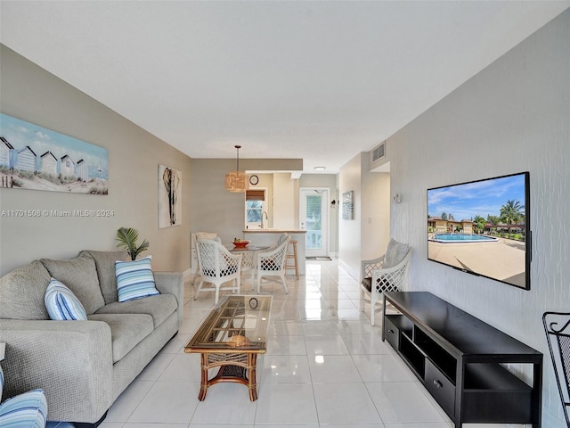 living room with light tile patterned floors