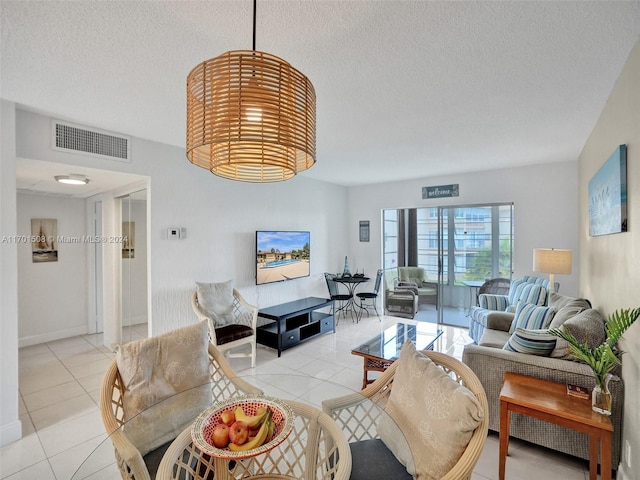 tiled living room with a textured ceiling