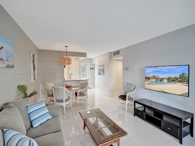 living room with light tile patterned floors