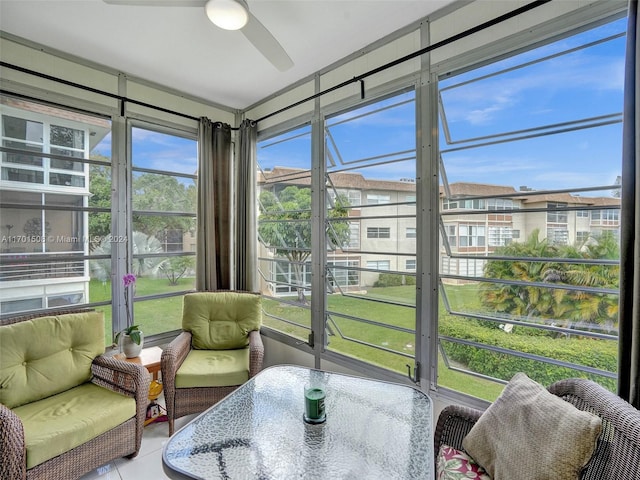 sunroom / solarium with ceiling fan and a healthy amount of sunlight