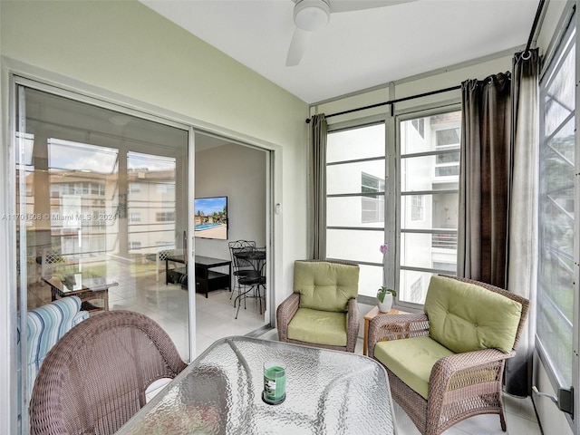 sunroom featuring a wealth of natural light and ceiling fan