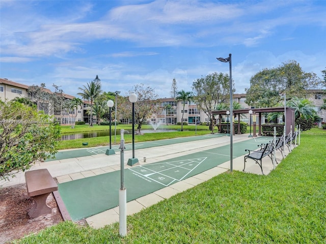 view of home's community featuring a lawn