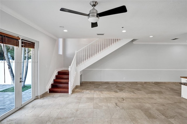 stairway with ceiling fan, crown molding, and french doors