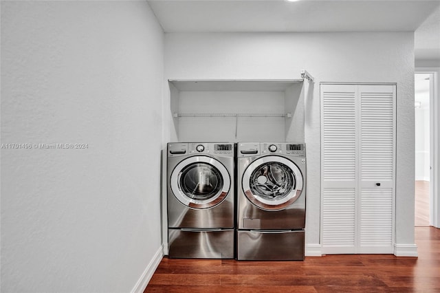 laundry room featuring dark hardwood / wood-style floors and independent washer and dryer