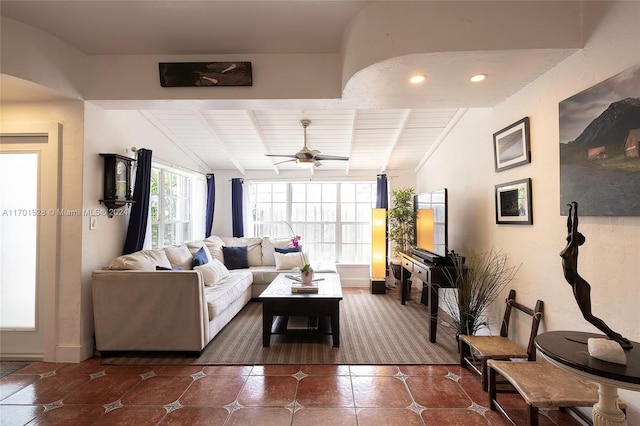 living room featuring vaulted ceiling with beams, ceiling fan, and wood ceiling