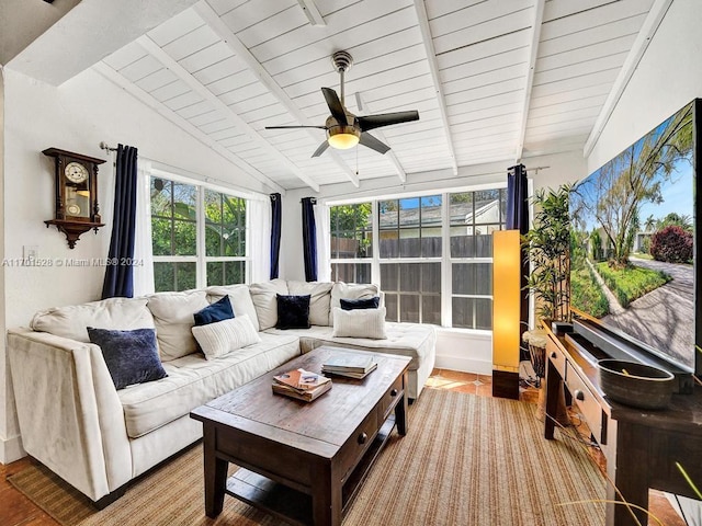 sunroom / solarium with vaulted ceiling with beams, ceiling fan, and wood ceiling