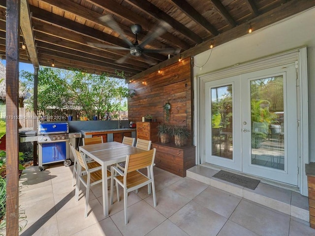 view of patio / terrace featuring french doors, an outdoor kitchen, area for grilling, and ceiling fan