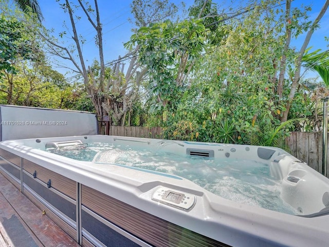 exterior space featuring a hot tub