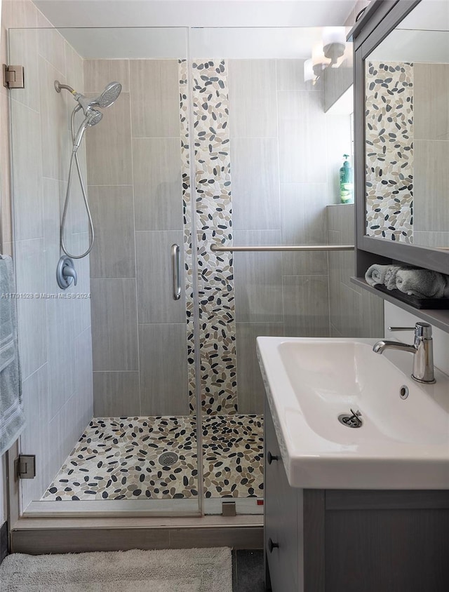 bathroom with vanity and an enclosed shower